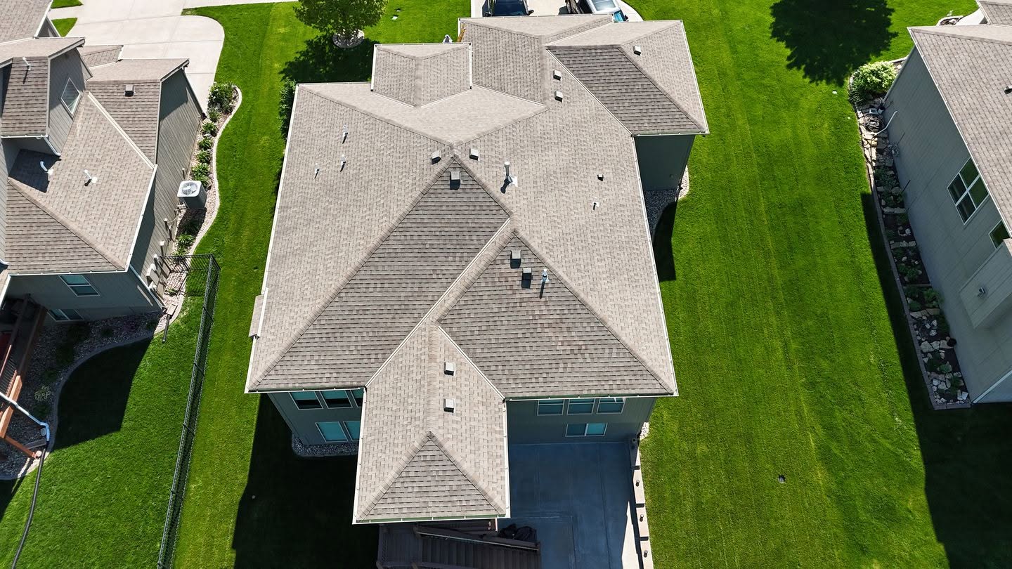Asphalt shingle roof with heat tape installation and ventilation for ice dam prevention.