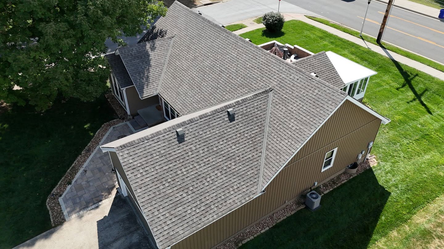 New asphalt shingle roof replacement and storm damage restoration by Brown Roofing LLC.
